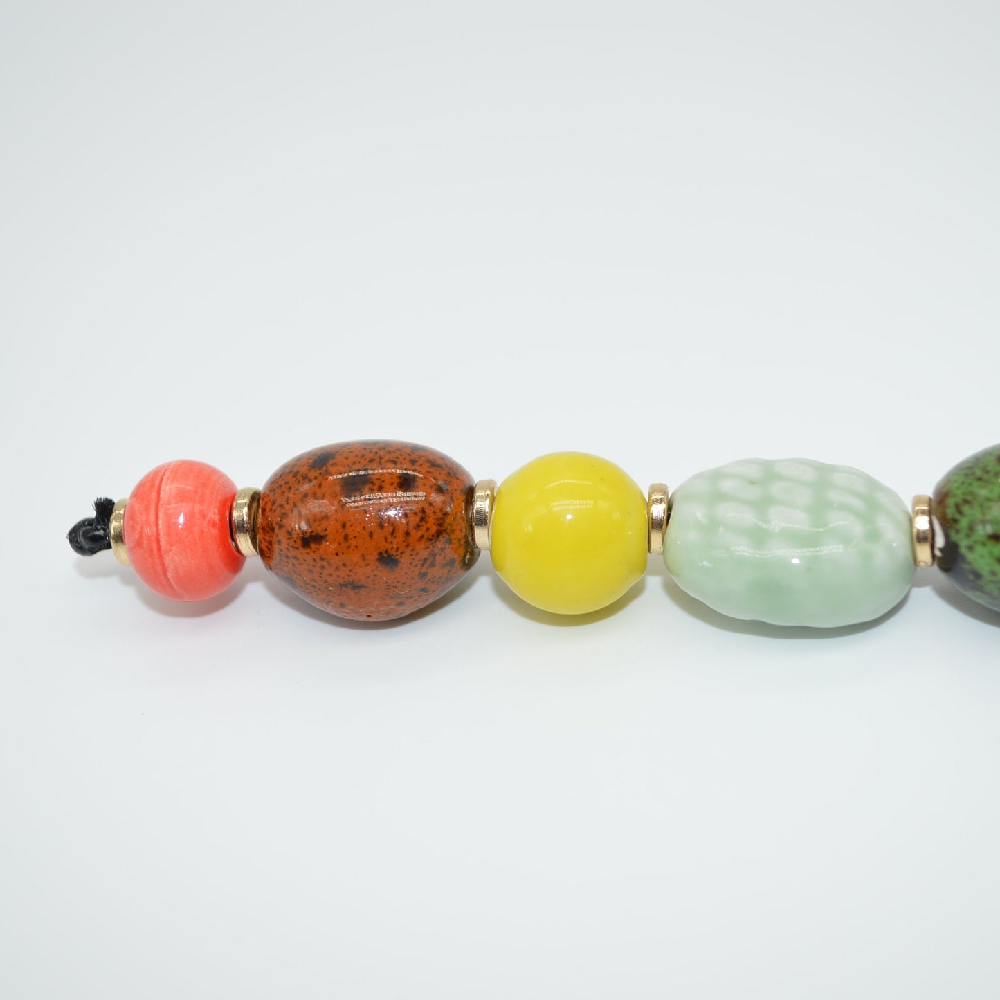 Colorful beaded necklace on a white background