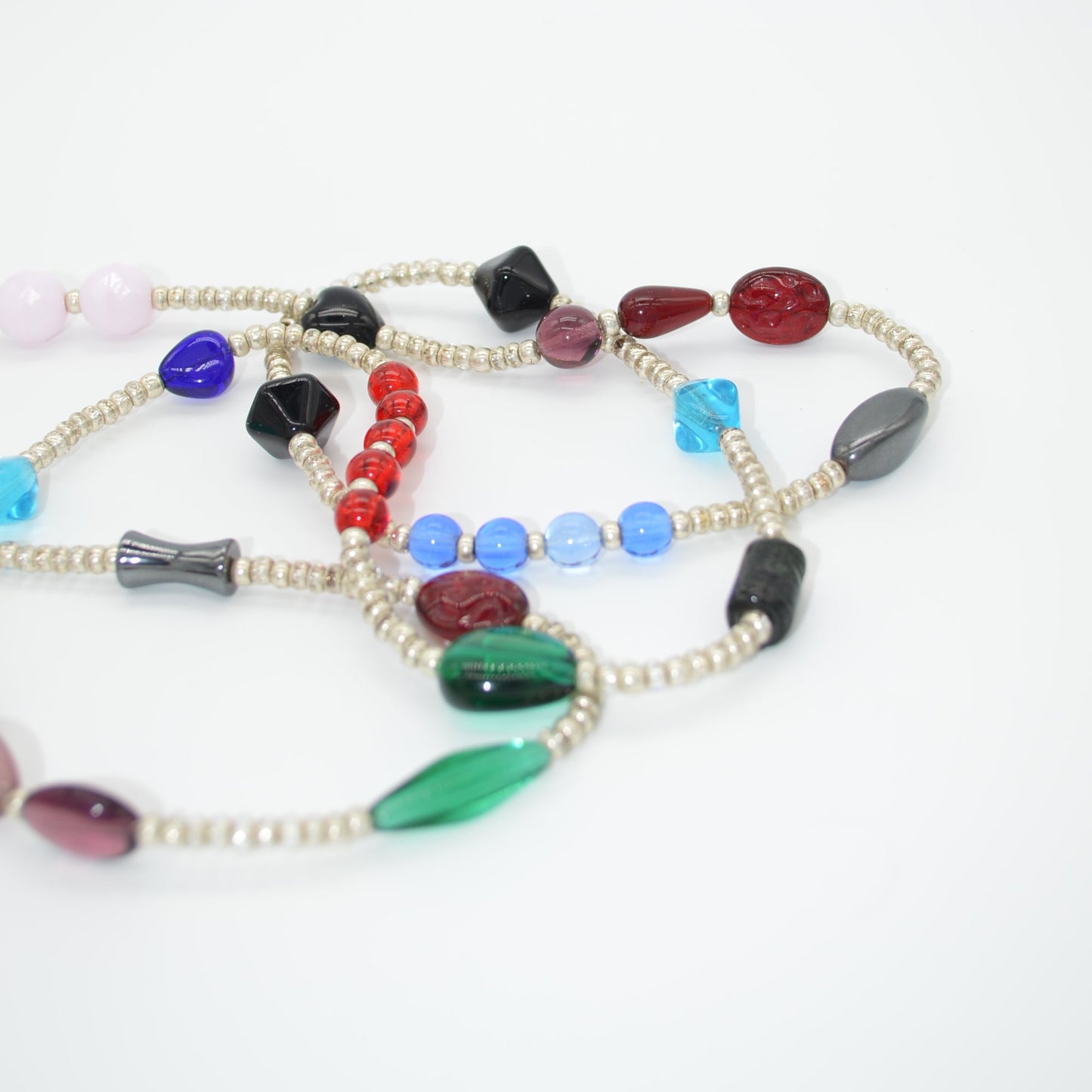 Colorful beaded necklace on a white background close up