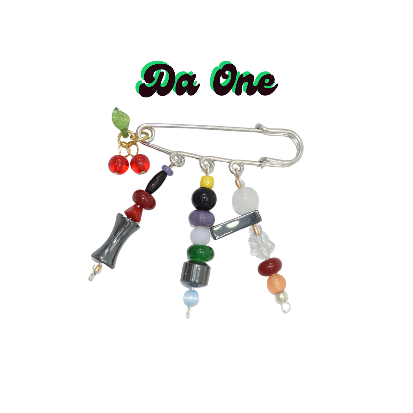 Decorative brooch with beads and charms on a white background, branded 'Da One'.