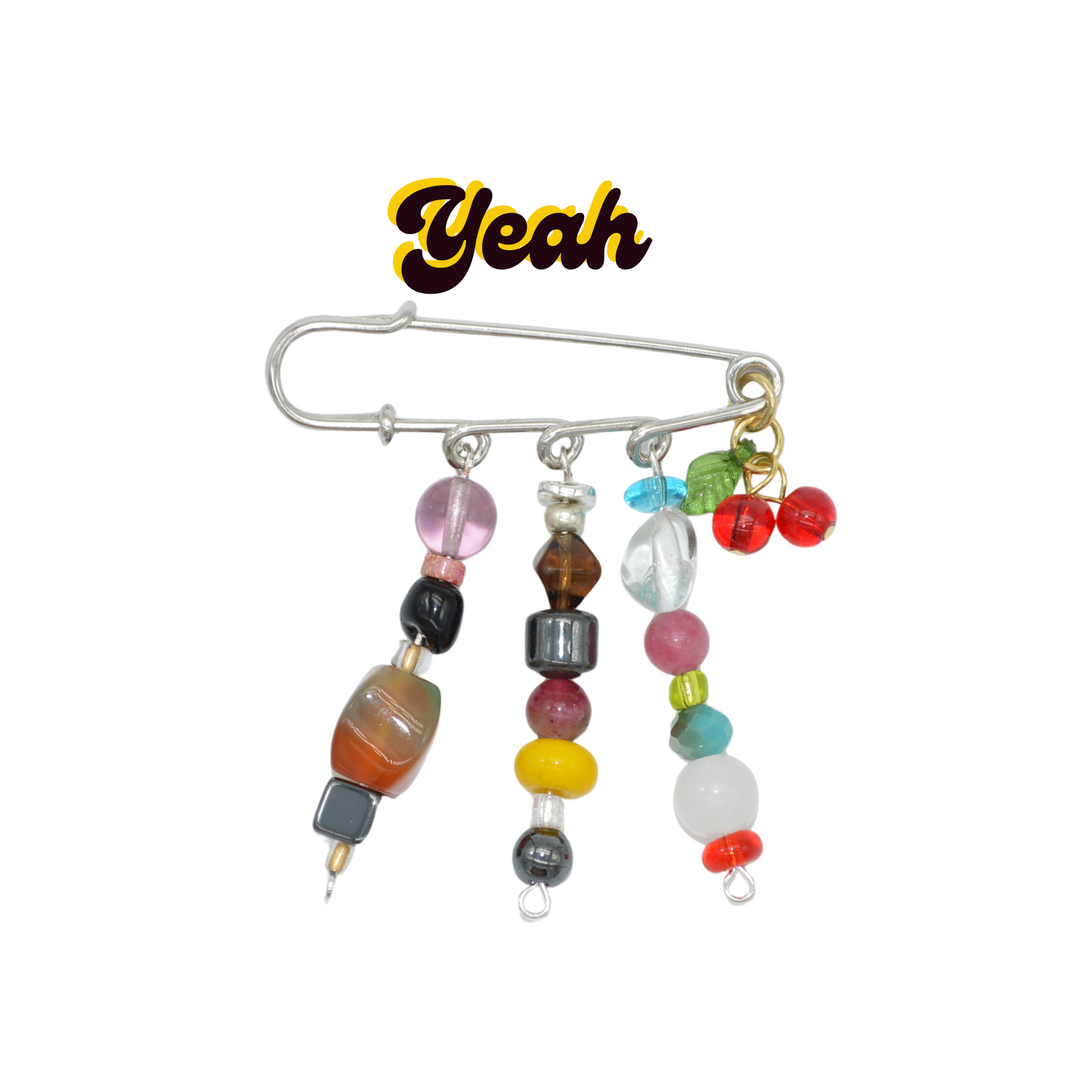 Colorful beaded brooch with a silver clasp on a white background