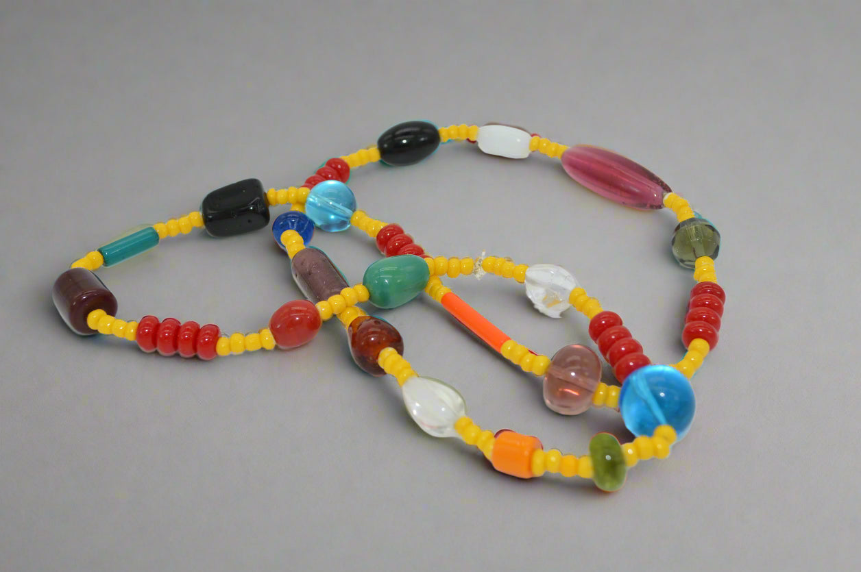 Colorful beaded necklace on a white background