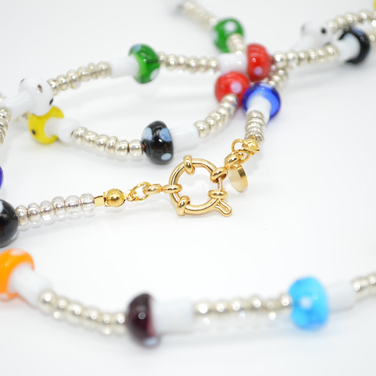 Colorful beaded bracelets on a white background
