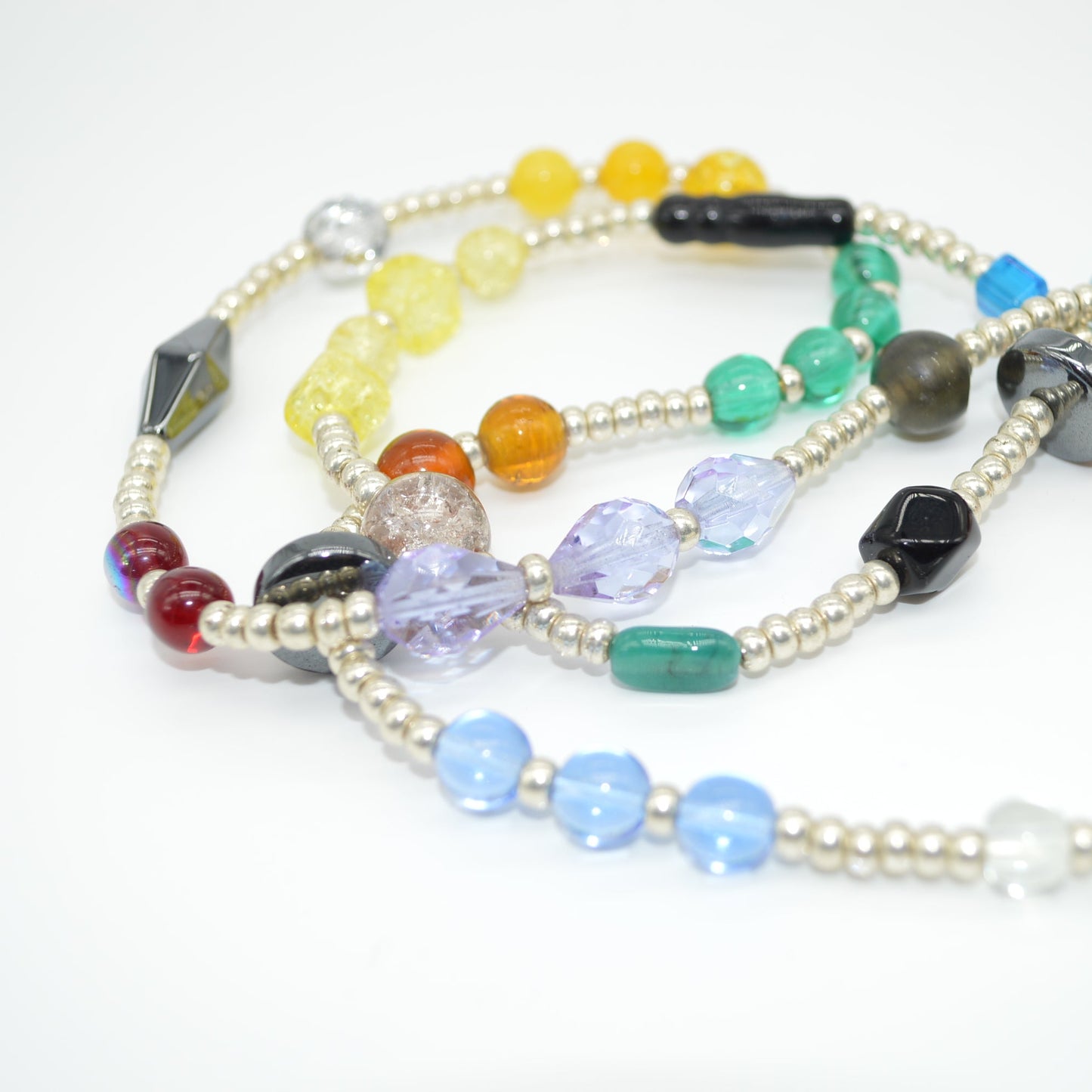 Colorful beaded necklaces on a white background