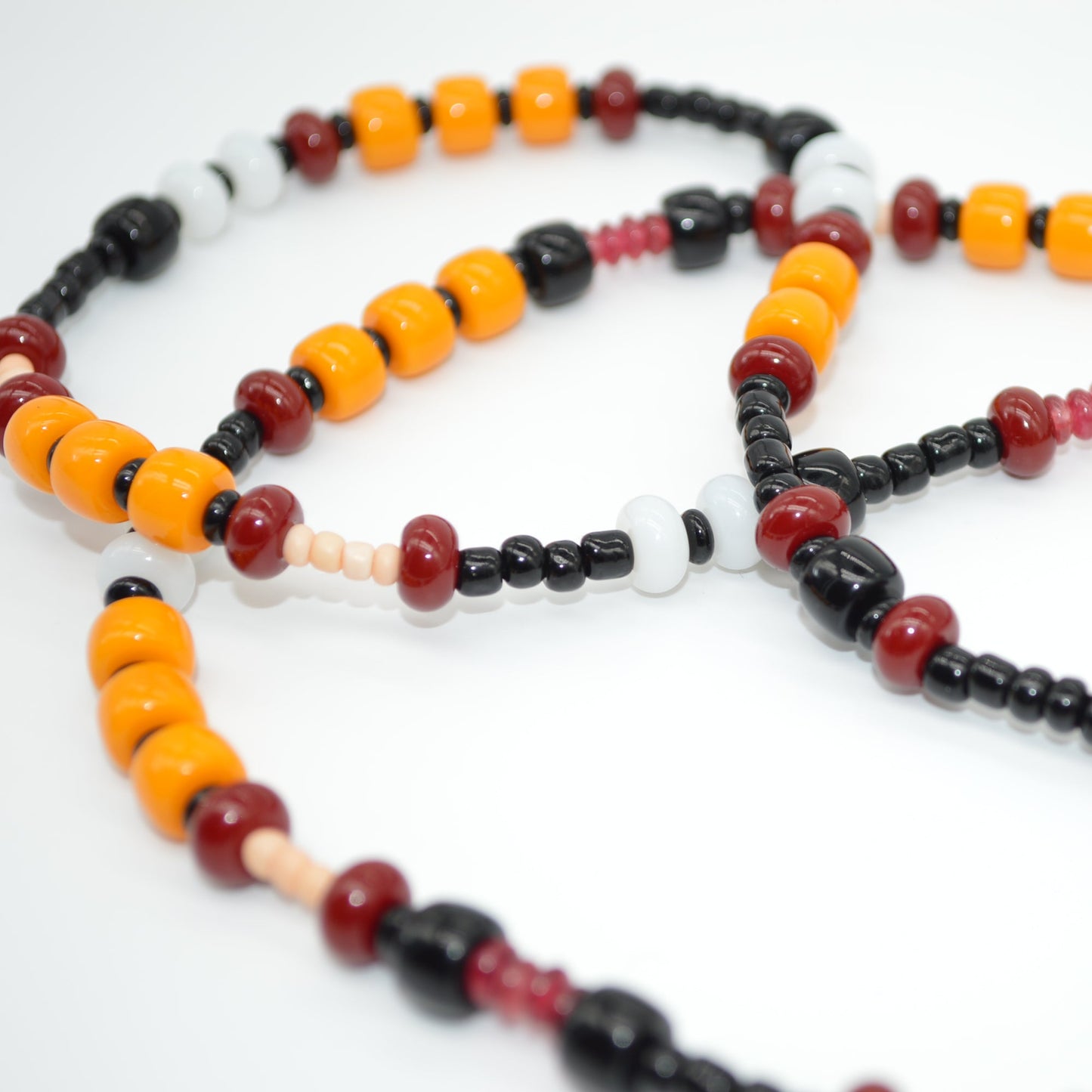 Colorful beaded necklace on a white background
