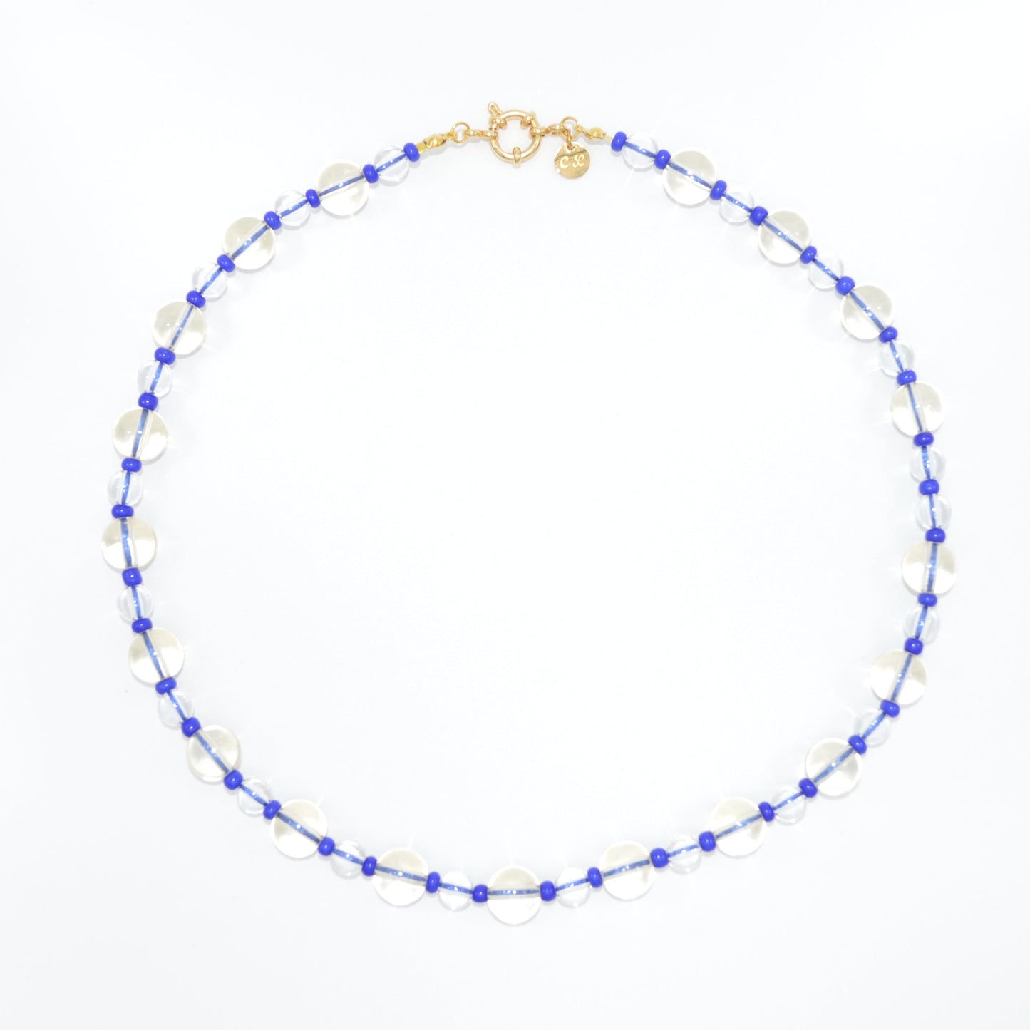 Necklace with blue and white beads on a white background