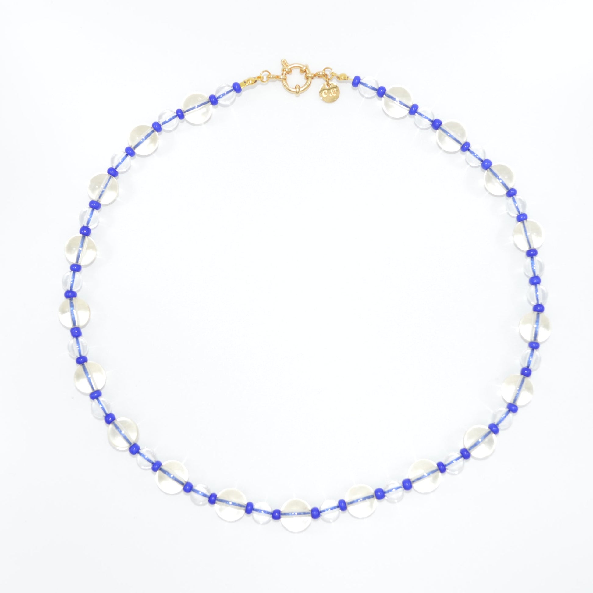 Necklace with blue and white beads on a white background