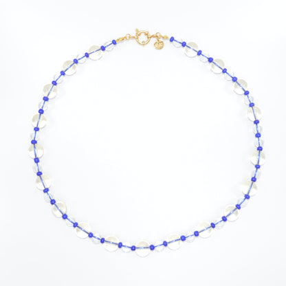 Necklace with blue and white beads on a white background