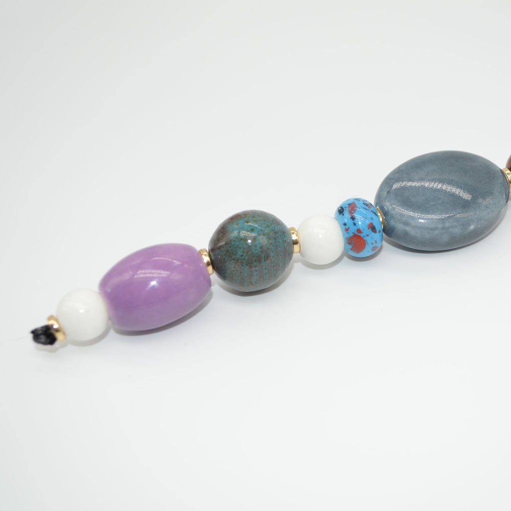 Colorful beaded necklace on a white background