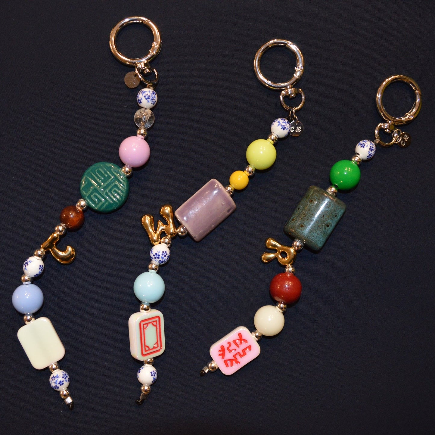 Colorful beaded keychains on a black background