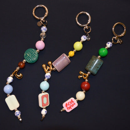 Colorful beaded keychains on a black background