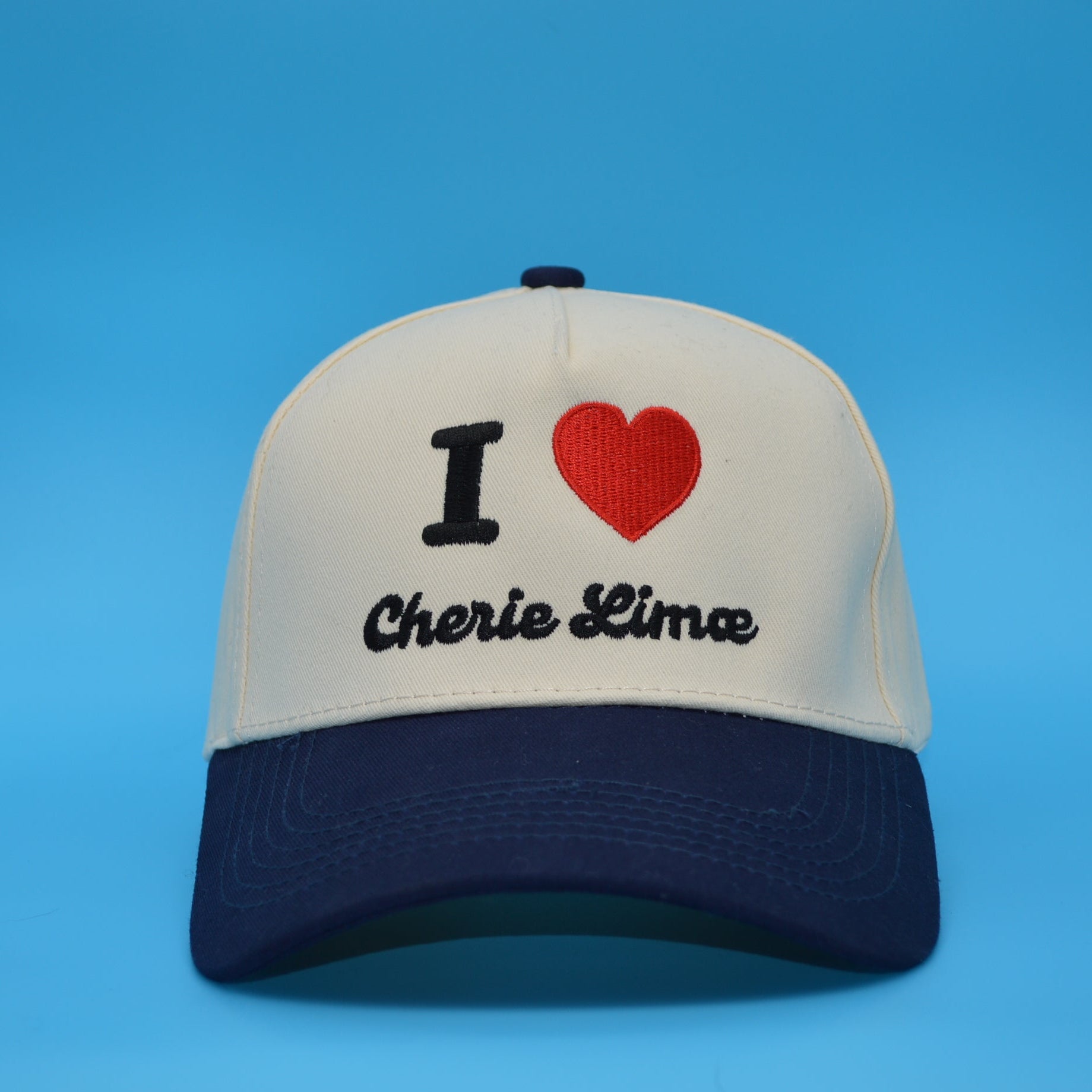 Cap with 'I ❤️ Cherie Lima' text on a blue background