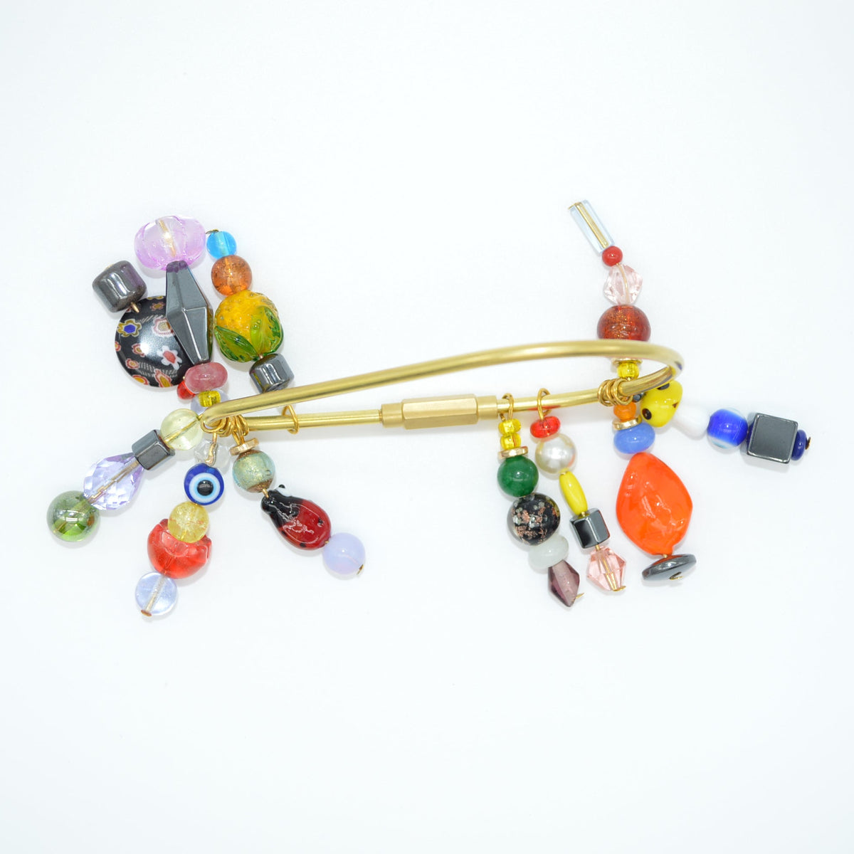 Colorful beaded clip on a white background