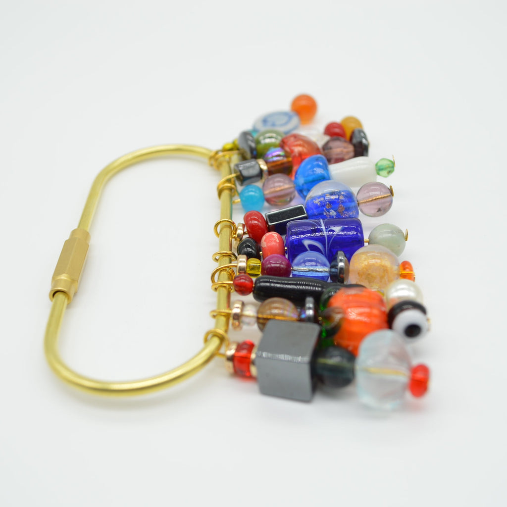Colorful beaded clip on a white background