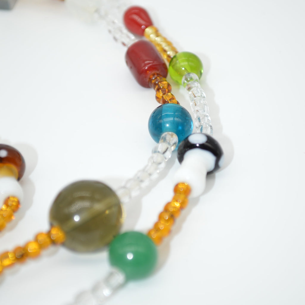 Multicolored beaded necklace on a white background
