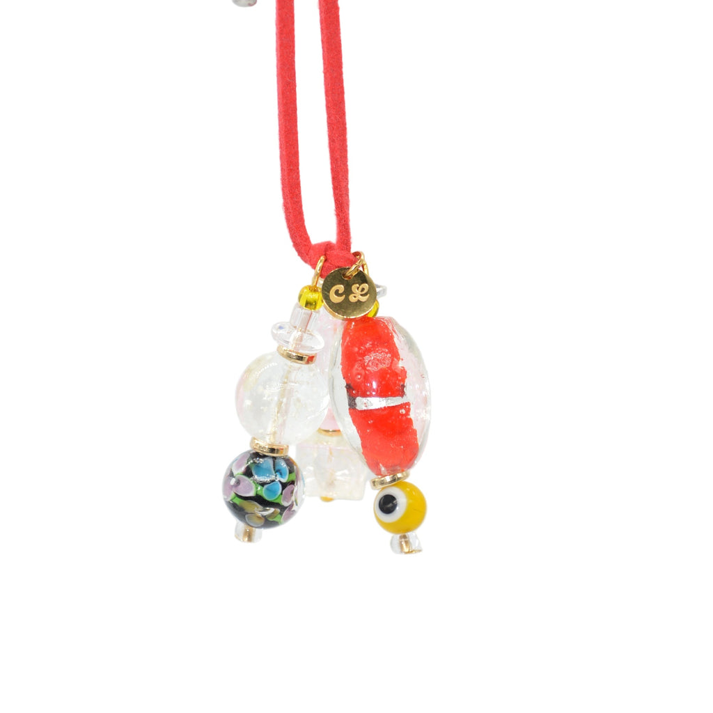 Decorative hair tie with colorful beads on a white background