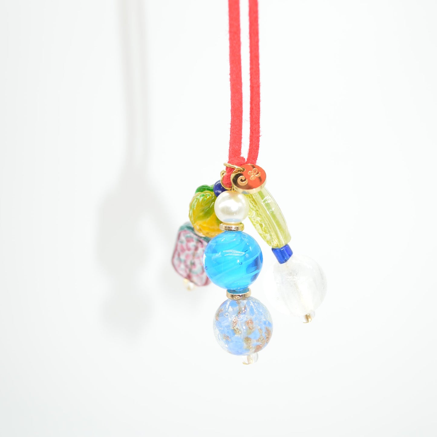 Colorful hair tie with beads on a white background