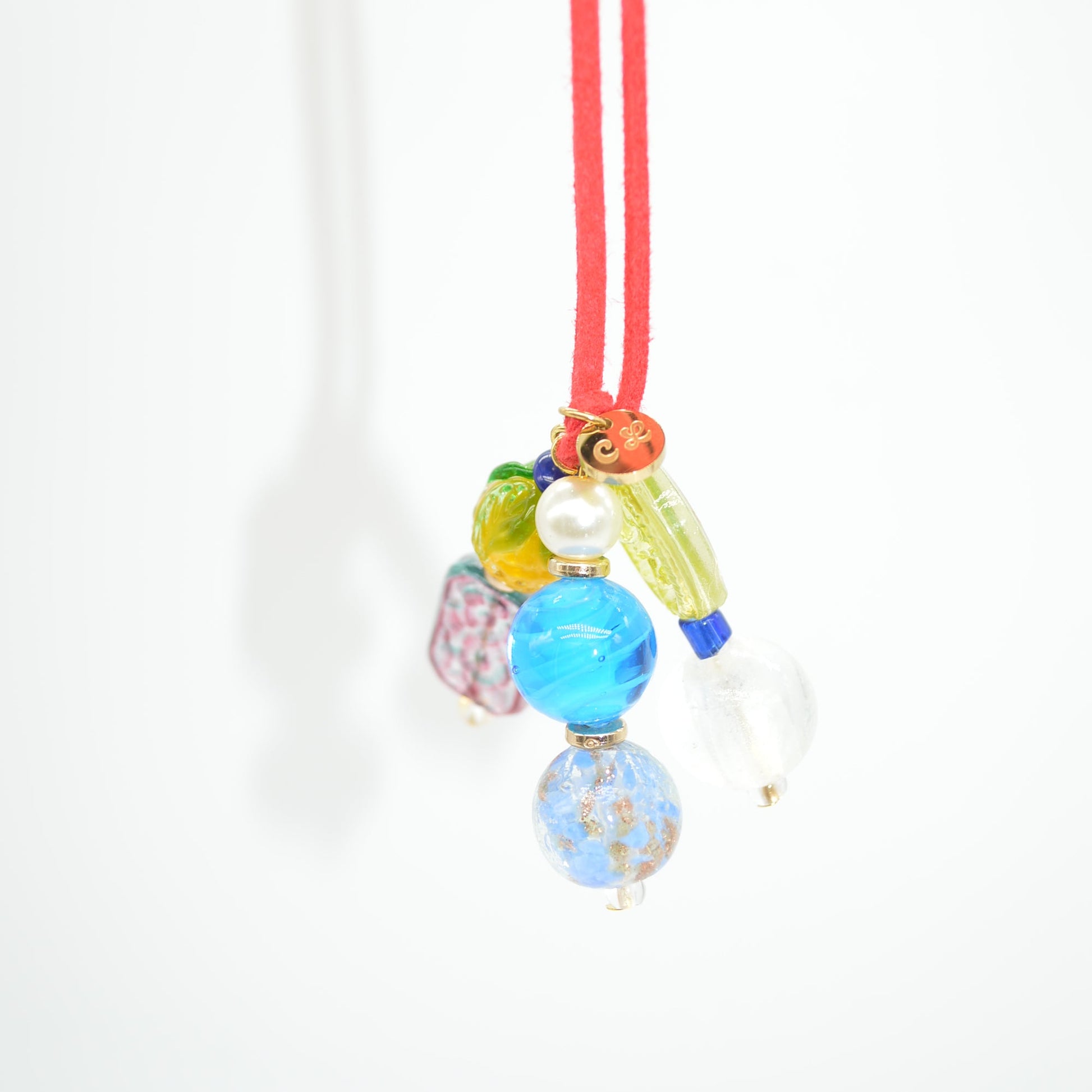 Colorful hair tie with beads on a white background