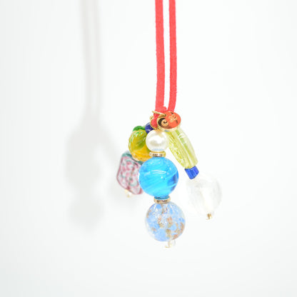 Colorful hair tie with beads on a white background