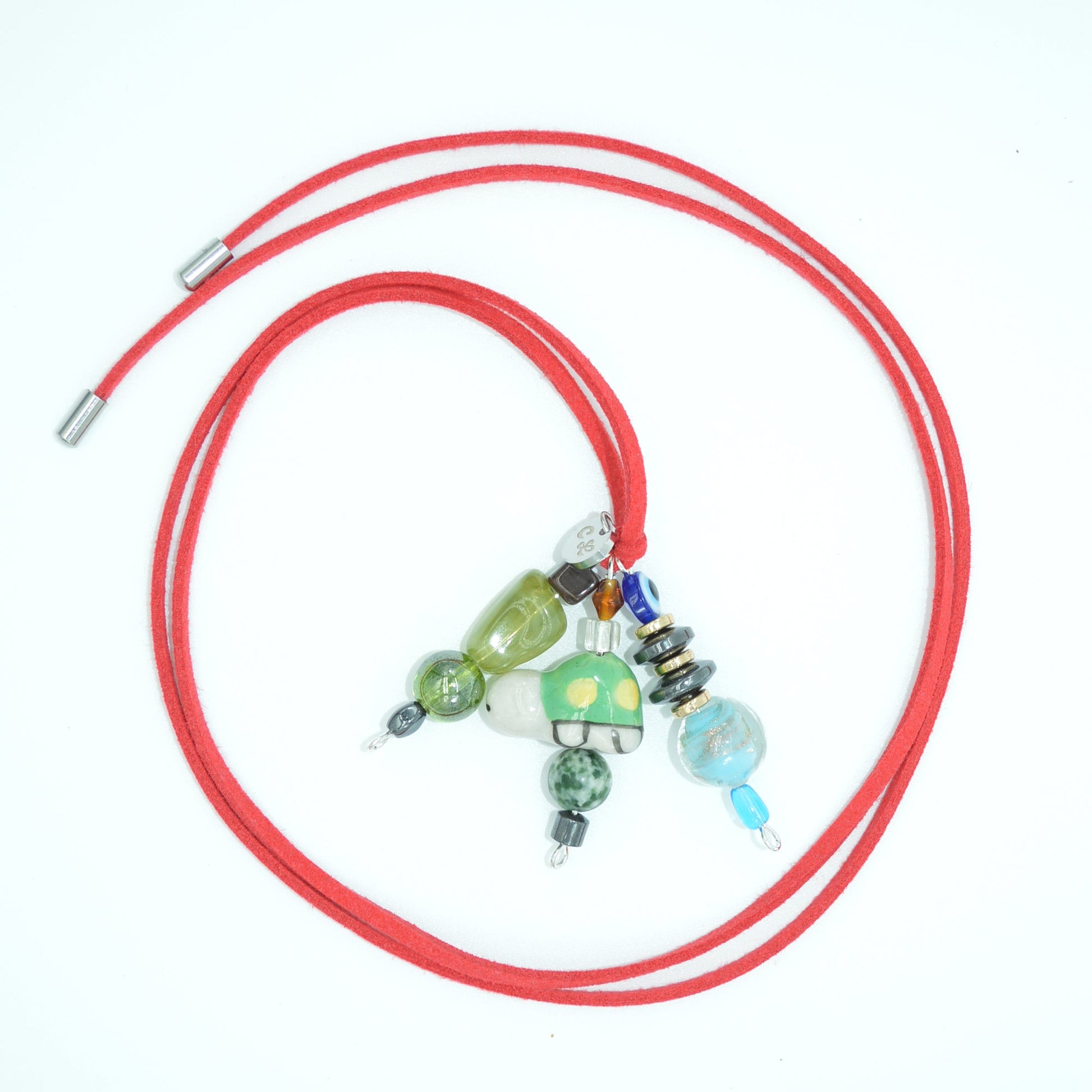 Red cord with colorful beads on a white background