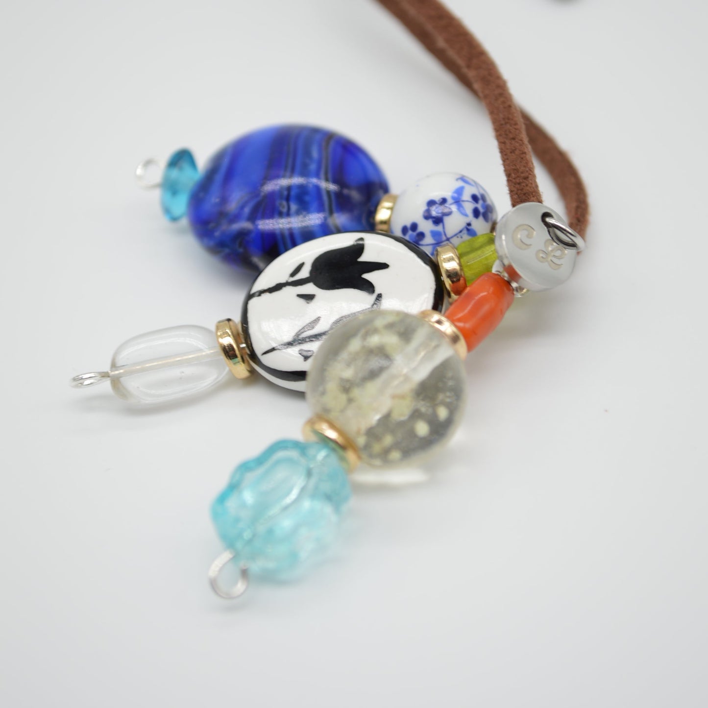 Necklace with colorful beads on a white background