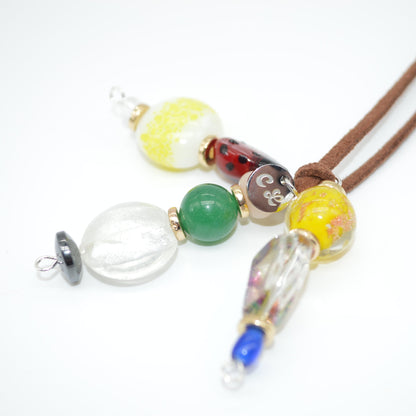 Necklace with colorful glass beads on a white background