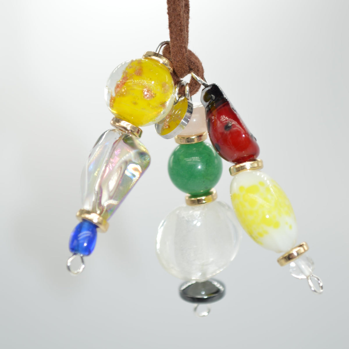 Colorful beaded charm on a white background