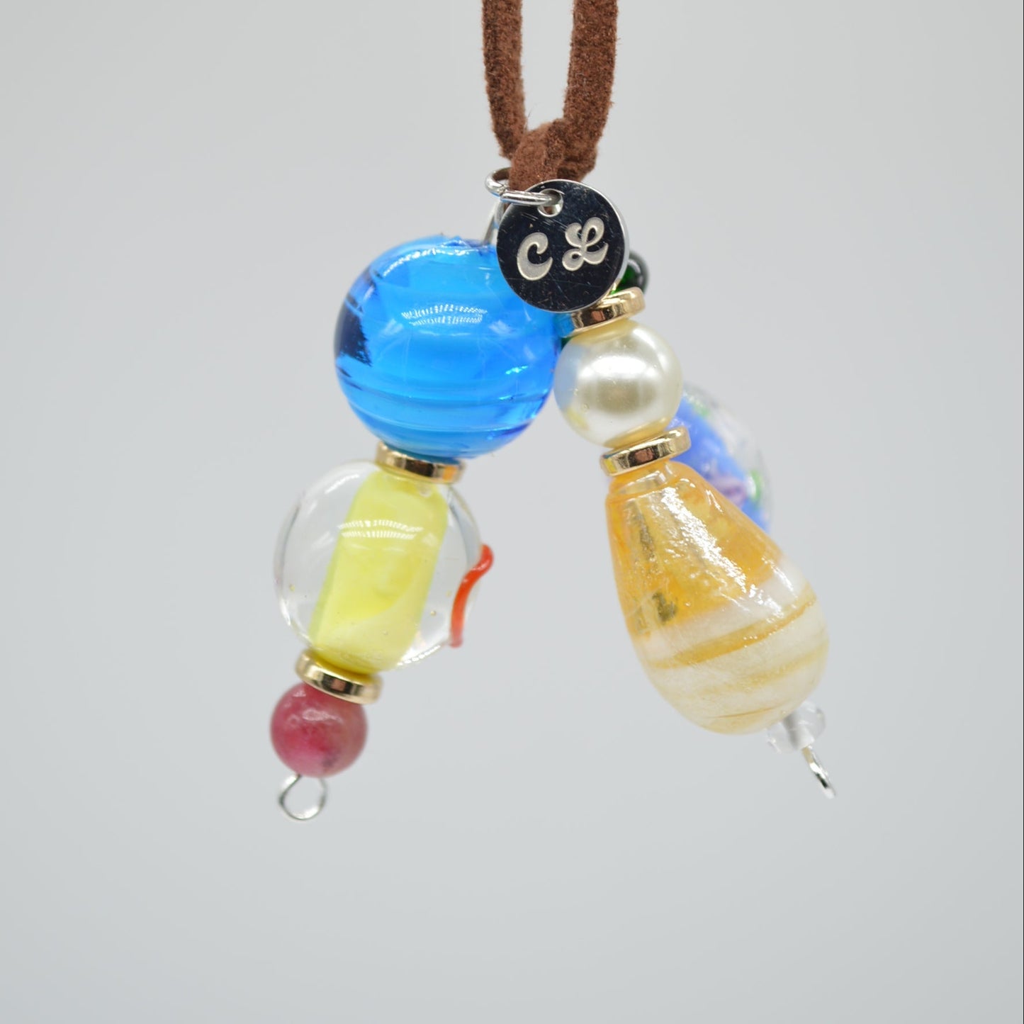 Necklace with colorful beads on a light gray background
