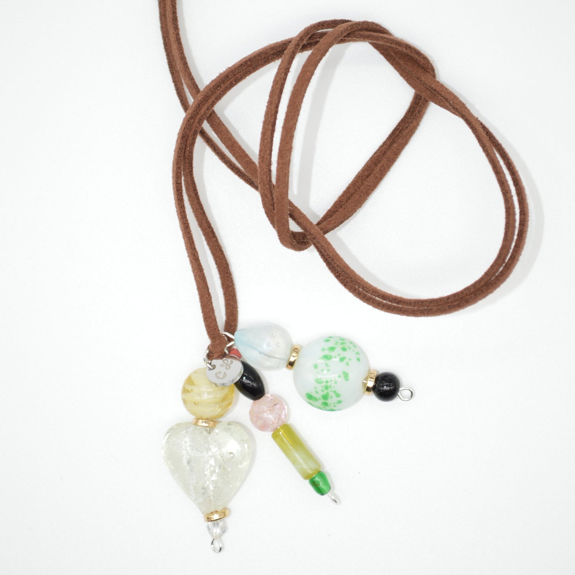 Necklace with brown cord and multicolored beads on a white background