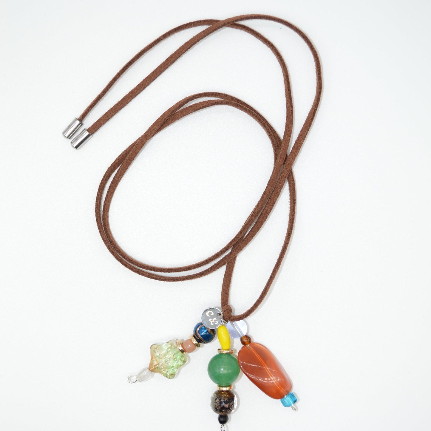 Brown cord with colorful beads on a white background