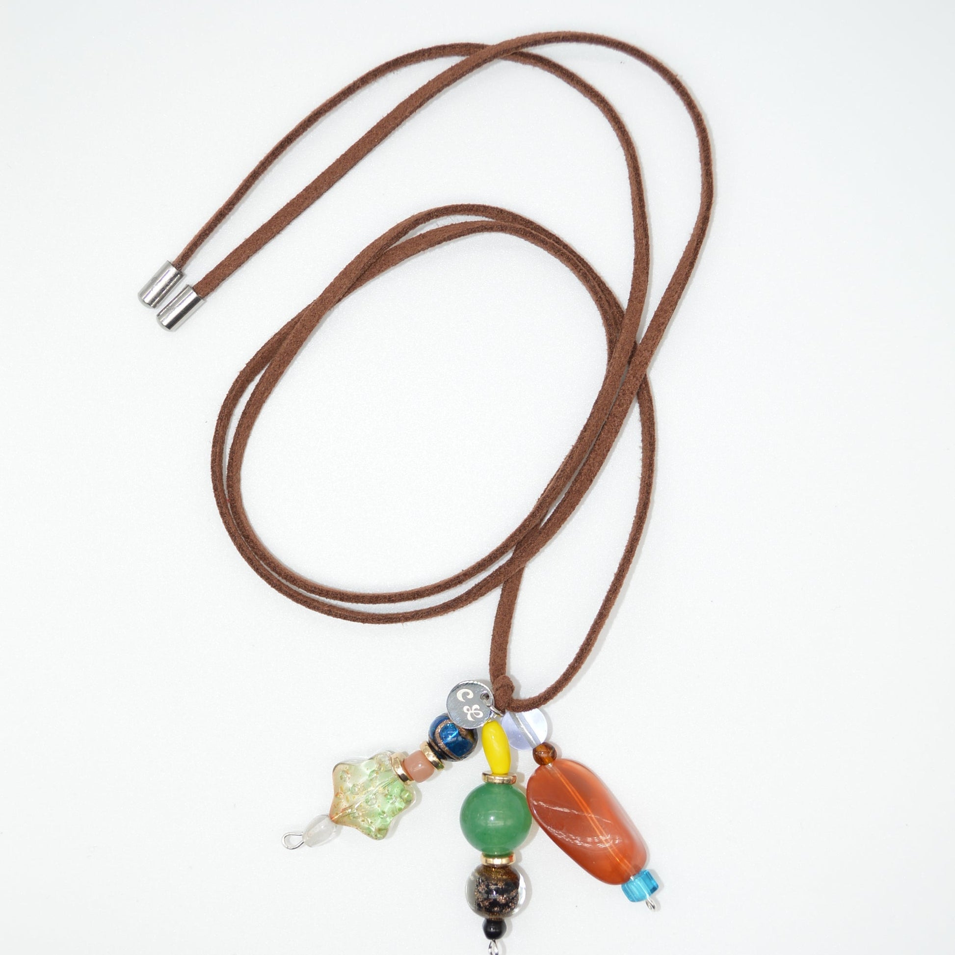 Brown cord with colorful beads on a white background