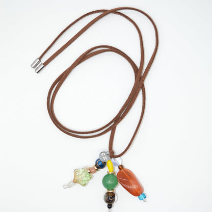 Brown cord with colorful beads on a white background