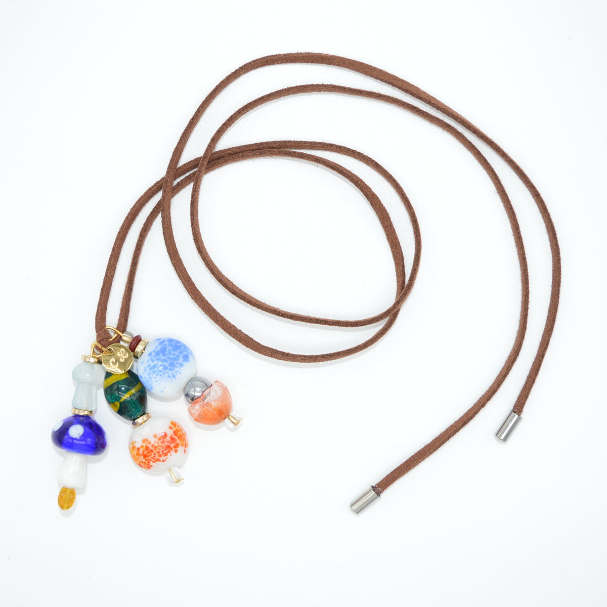 Brown leather cord with colorful beads on a white background