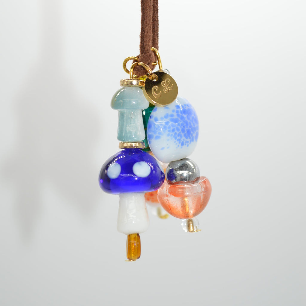 Colorful beaded hair tie on a white background