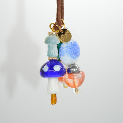 Colorful beaded hair tie on a white background