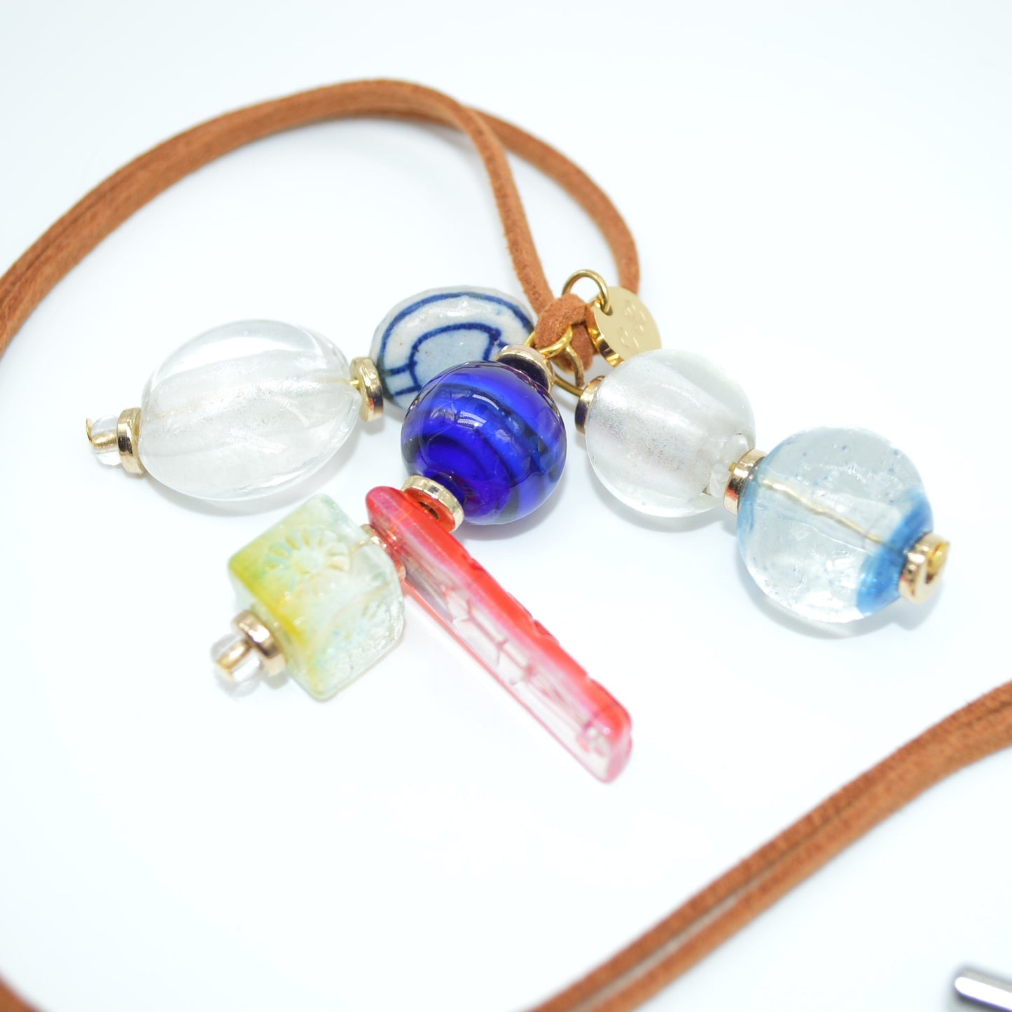 Necklace with colorful beads on a white background