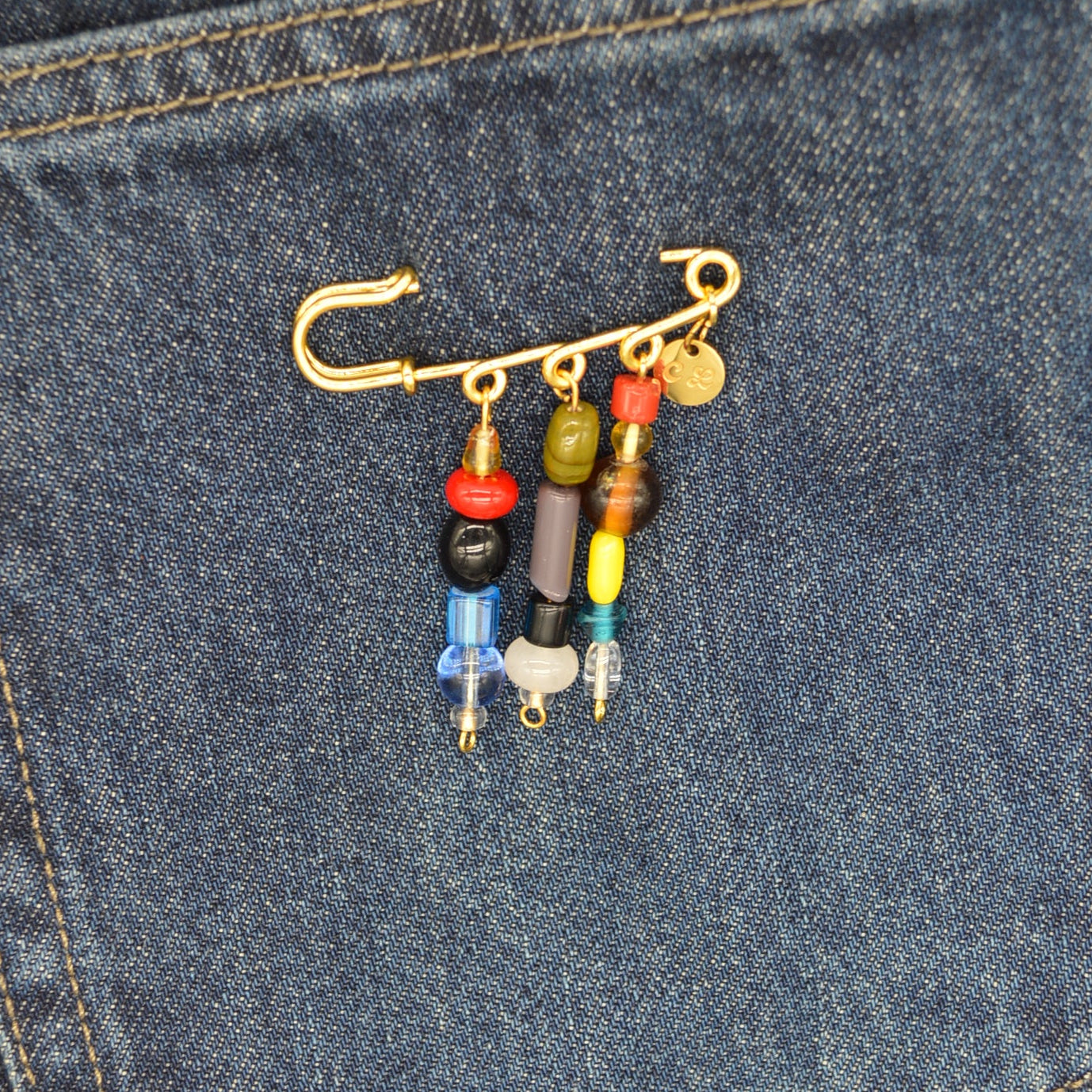 Set of fishing lures in a pocket of blue denim jeans
