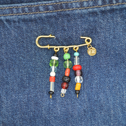 Colorful beaded keychain attached to a blue denim fabric
