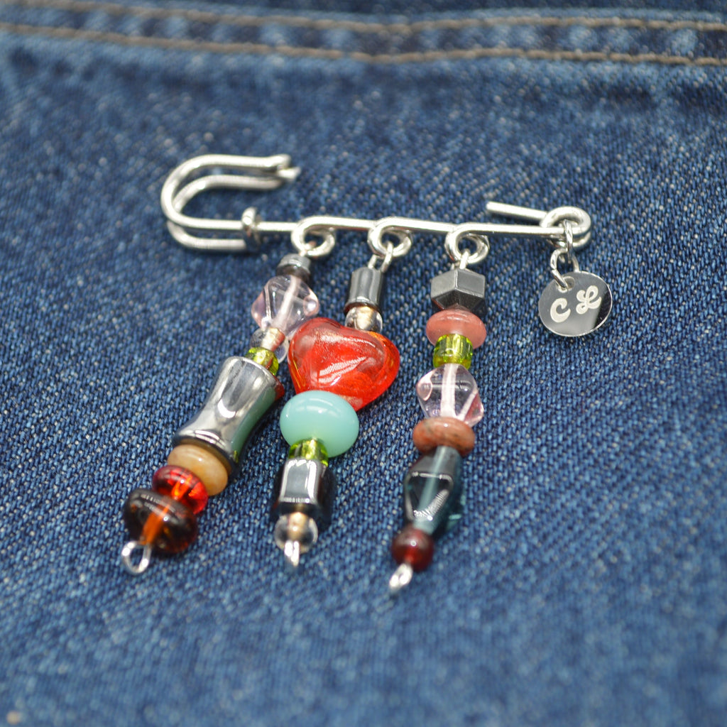 Beaded brouche on a denim background