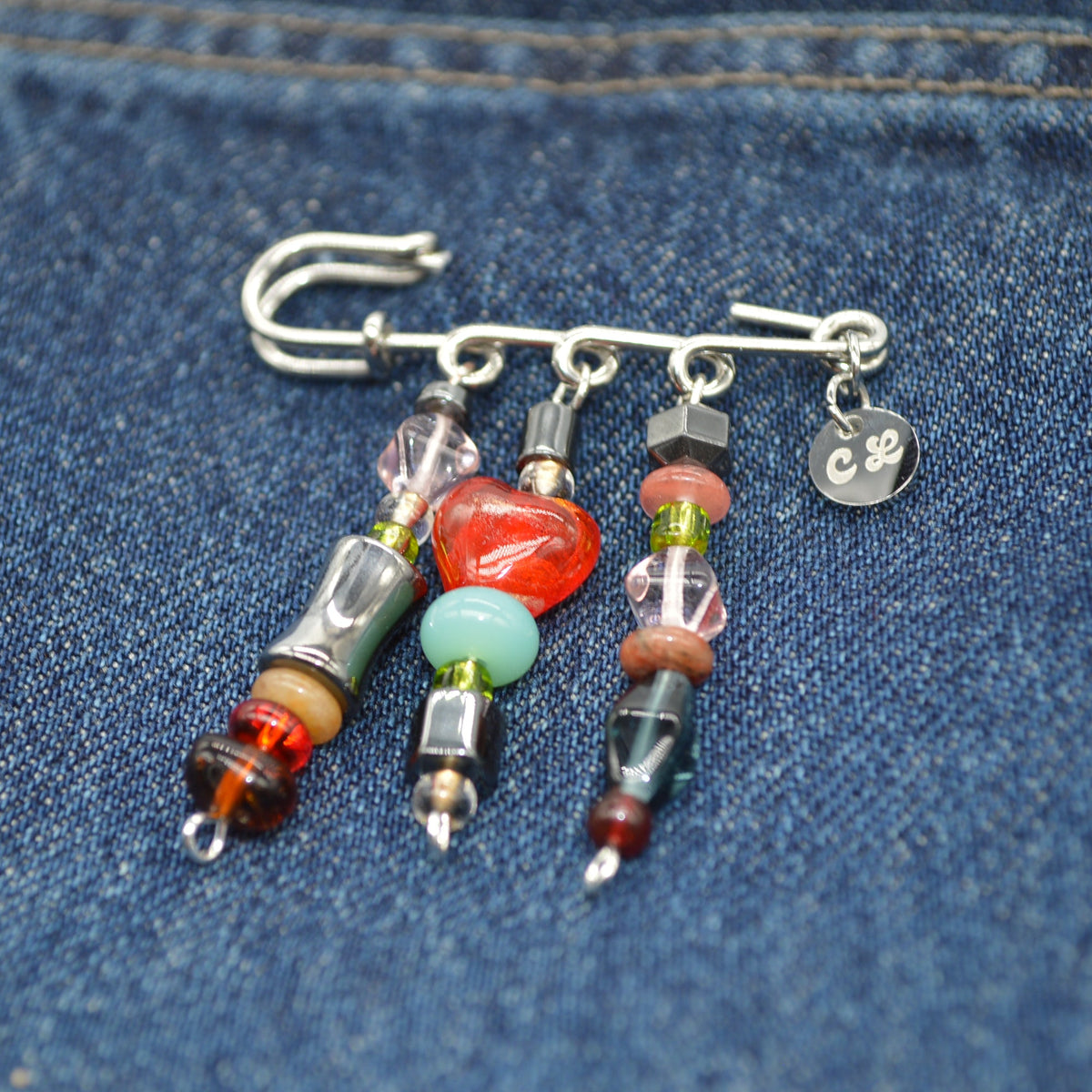 Beaded brouche on a denim background