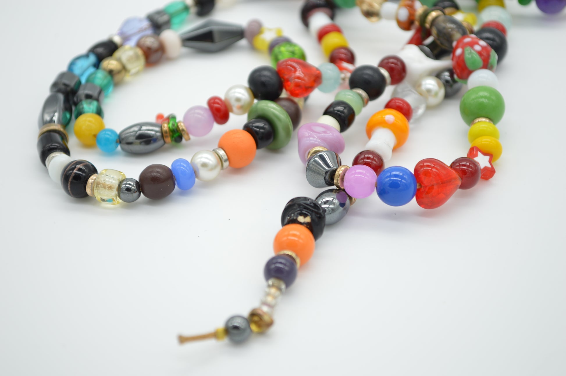 Colorful beaded necklace on a white background
