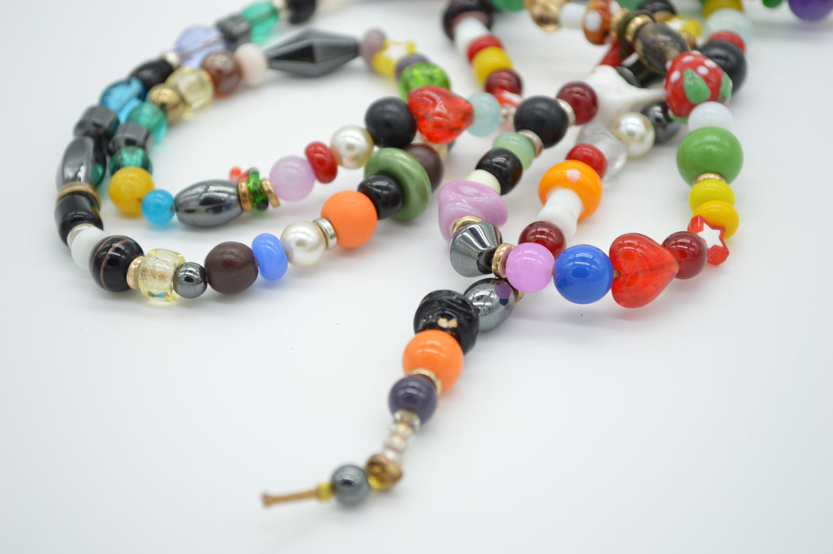 Colorful beaded necklace on a white background