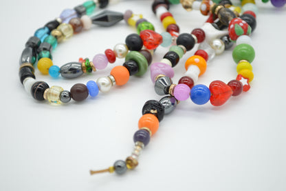 Colorful beaded necklace on a white background