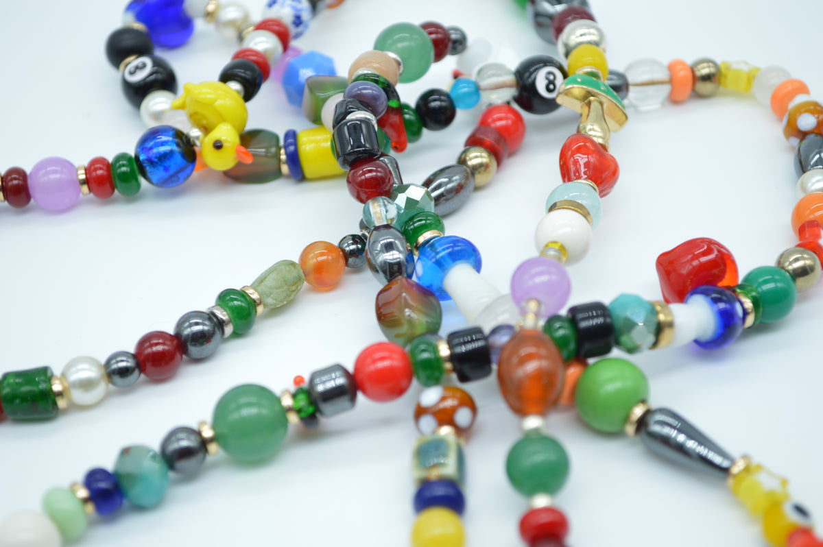 Colorful beaded necklaces on a white background