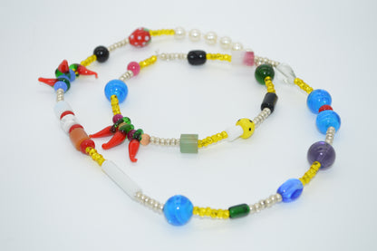 Colorful beaded necklace on a white background