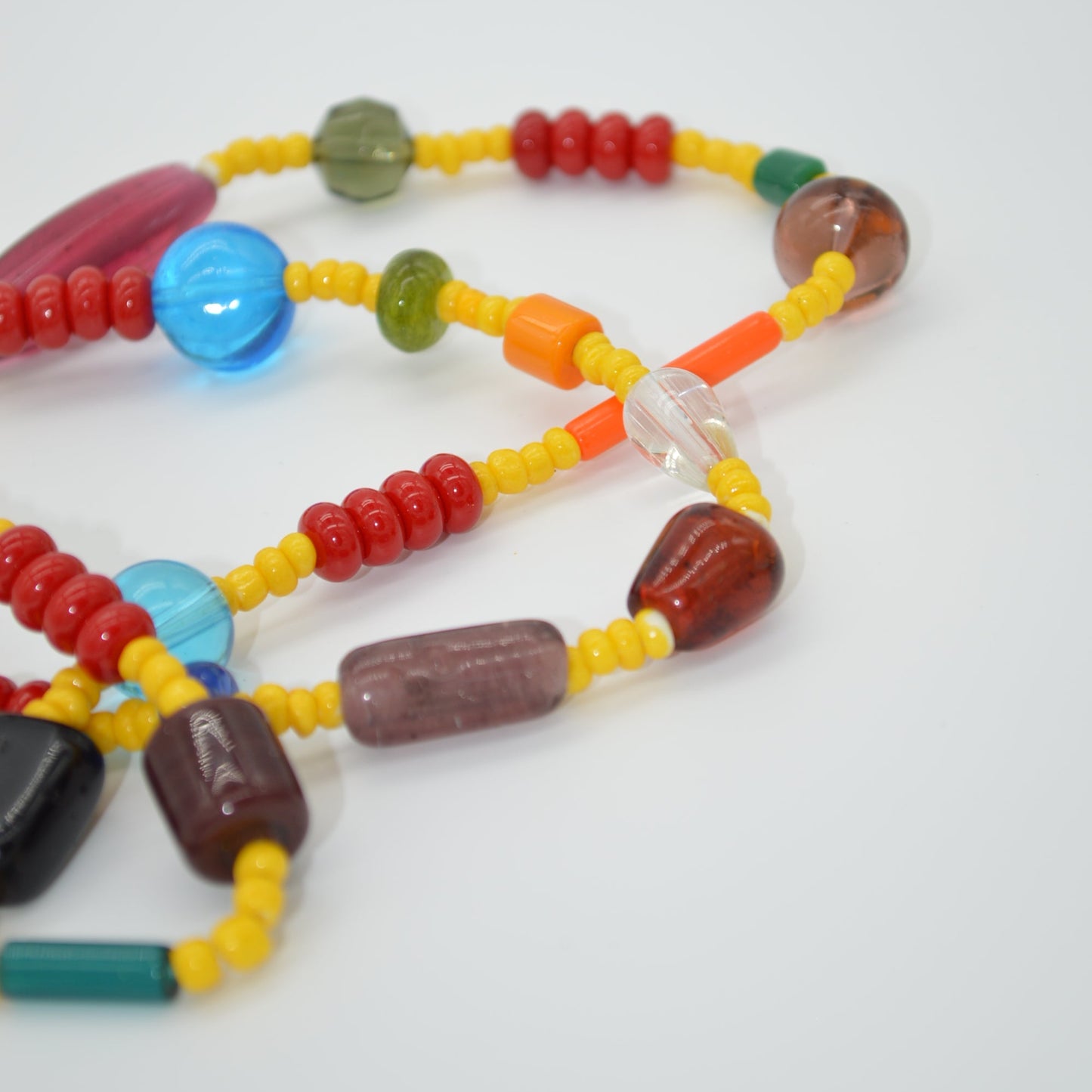 Colorful beaded necklace on a white background