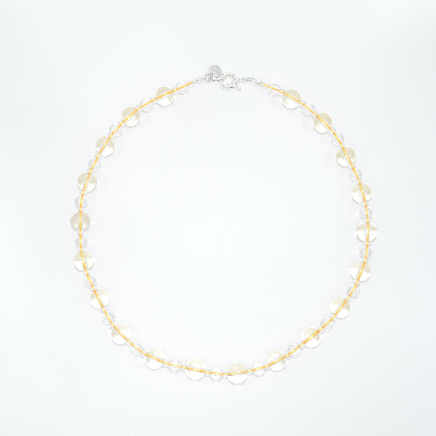 clear and yellow necklace on a white background