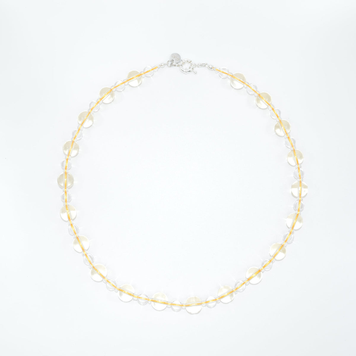 clear and yellow necklace on a white background