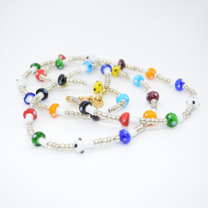 Colorful beaded necklace on a white background