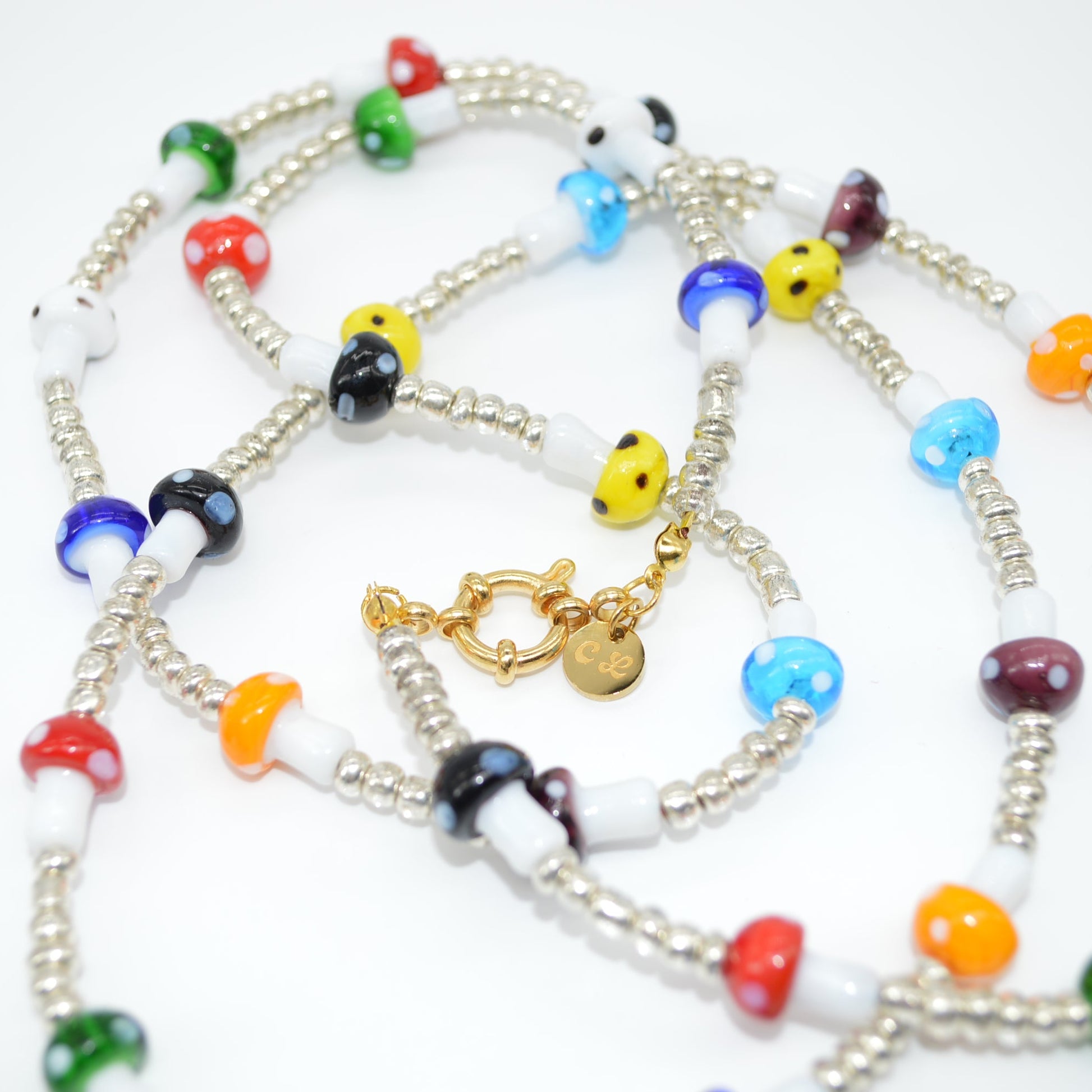 Colorful beaded necklace with a gold clasp on a white background