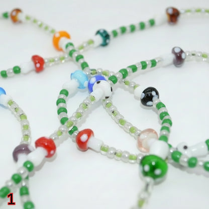 Colorful beaded necklaces on a white background
